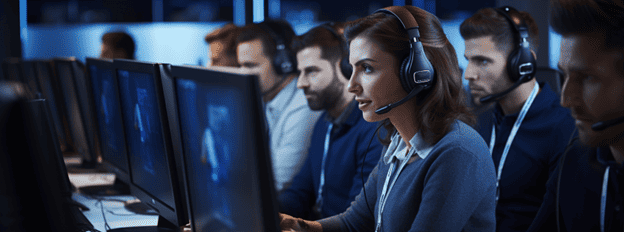 Contact center agents work to handle customer service inquiries at a large corporation